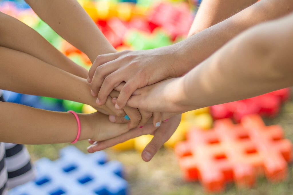 Children's hands meeting in cooperation